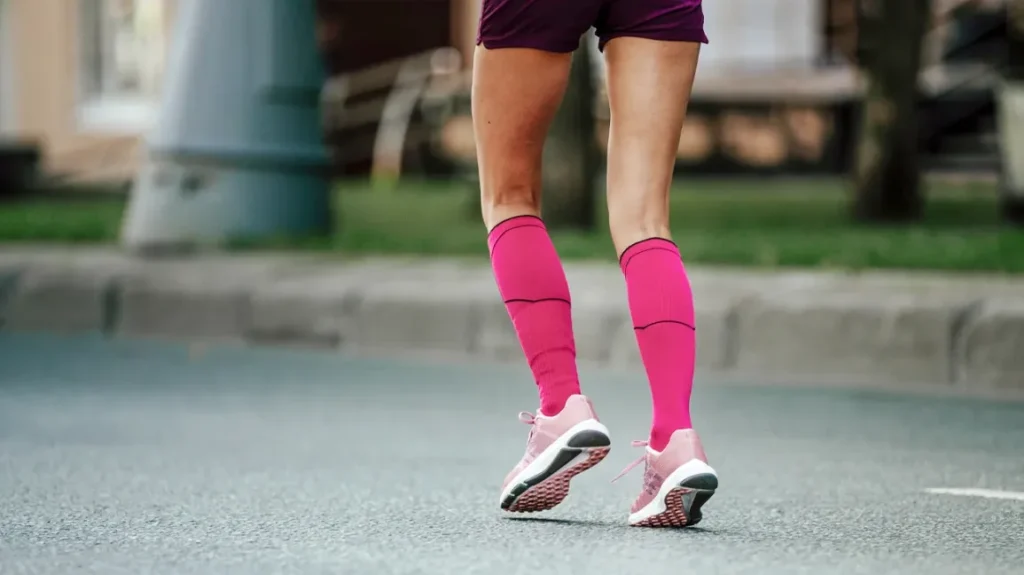 A girl running in compression socks